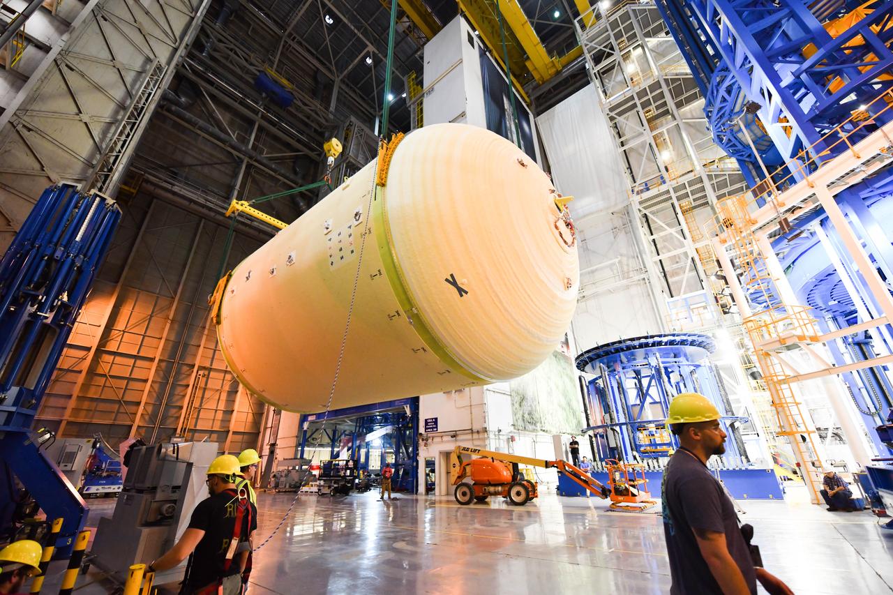 The Space Launch System (SLS) rocket’s liquid oxygen tank structural test article was manufactured and stacked in June 2019 at NASA’s Michoud Assembly Facility in New Orleans. To construct the test article, Boeing technicians at Michoud moved the liquid oxygen tank to the Vertical Assemby Building stacking and integration area. Here, they added simulators to mimic the two structures that connect to the tank, the intertank and the forward skirt.  This structural hardware for the SLS core stage for America’s new deep space rocket is structurally identical to the flight version of the tank. It will be shipped on the Pegasus barge to NASA’s Marshall Space Flight Center in Hunstville, Alabama, where it will undergo a series of tests that simulate the stresses and loads of liftoff and flight. These tests will help ensure designs are adequate for successful SLS missions to the Moon and beyond. The flight liquid oxygen tank along with the liquid hydrogen tank supplies more than 500,000 gallons of propellant to the core stages four RS-25 engines, which produce 2 million pounds of thrust to help send the SLS rocket to space.